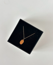 FEBRUARY OVAL DISC NECKLACE - The Vault